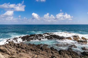 Fototapeta na wymiar Sainte-Anne, Martinique, FWI - Waves in the blue eye hole (oeil bleu) in Ferré Cape