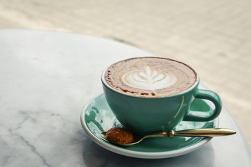 A cup of coffee with latte art on top