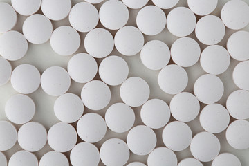 Pills tablets vitamins capsules drugs white close up macro shot