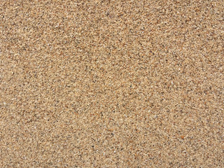 Coarse sand and small stones background texture