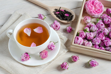 Obraz na płótnie Canvas Cup of tea with..  roses