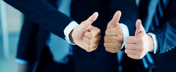 Close up of Hands the business people with three thumbs up Is working as a team work that helps the...
