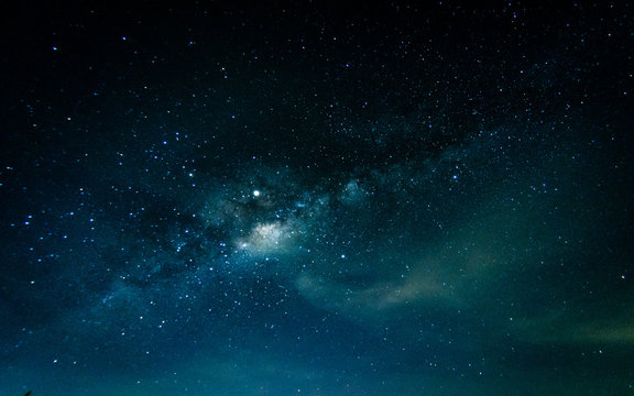 Milky way galaxy with stars and space in the universe background at thailand