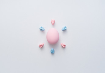 Easter bunnies around a big egg. abstract image in easter holiday concept