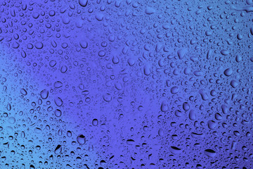 water bubbles on the glass on a beautiful blue background