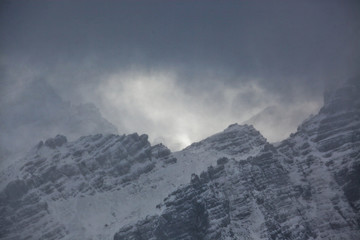 Beautiful fog in the high, rocky mountains in winter.