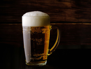 glass with beer and beer foam
