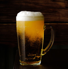 glass with beer and beer foam