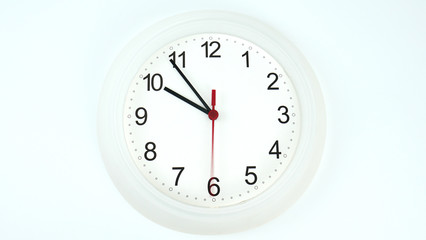 Clock beginning of time 09.54 am or pm, on white background, Copy space for your text, Time concept.