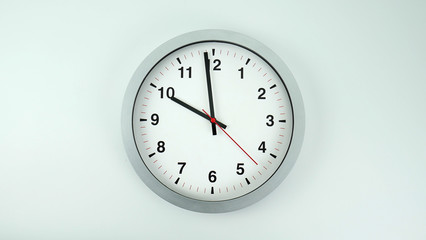 Gray clock beginning of time 09.59 am or pm, on white background, Copy space for your text, Time concept. .