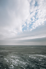 frozen water blue-green ice on the river. winter landscape with a pond.