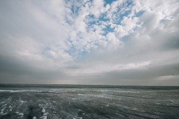 frozen water blue-green ice on the river. winter landscape with a pond.