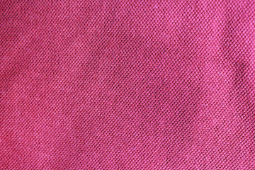 Purple textured fabric background, colorful light red or pink canvas. Empty clothing texture sufrace, blank purple color wallpaper with copy space 
