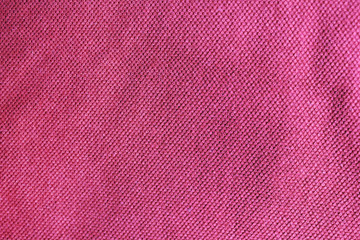 Purple textured fabric background, colorful light red or pink canvas. Empty clothing texture sufrace, blank purple color wallpaper with copy space 