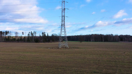 Tower of power lines in the forest. Electric tower line in Landscape view with Electricity and...
