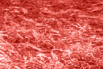 Red coral color background. Water pattern, abstract background