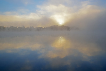Landscape of spring sunrise Whitford Lake in fog, Fort Custer State Park, Michigan, USA