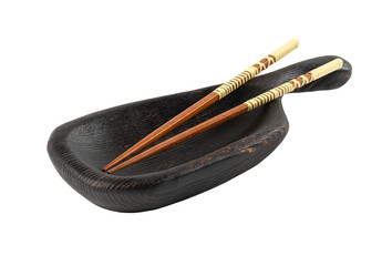 black wooden bowl with chopsticks isolated on a white background. Oriental cuisine