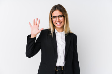 Young business caucasian woman smiling cheerful showing number five with fingers.
