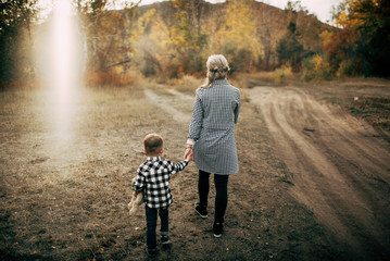 Fototapeta premium Mom and son have a nice happy time outdoor