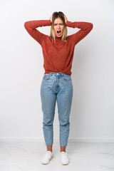 Full body young caucasian woman covering ears with hands trying not to hear too loud sound.
