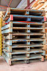 Old rusty metal pallets in production