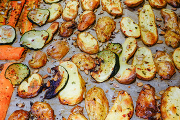 Stockholm, Sweden Grilled potatoes, carrots, zucchini, with salt, oil, and sunflower seeds.