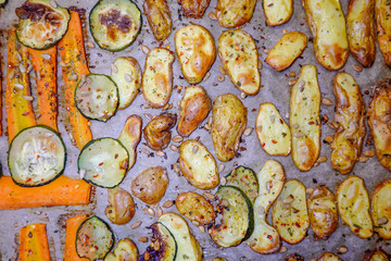 Stockholm, Sweden Grilled potatoes, carrots, zucchini, with salt, oil, and sunflower seeds.
