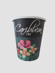 Isolated black takeaway disposable cup painted with Caribbean flowers and text "Caribbean FWI" on white background.