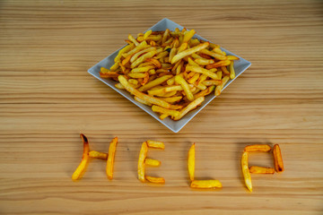 French fries on a dish and on the table