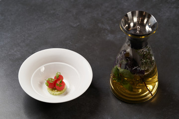 Fresh peeled chili tomatoes and minced cucumbers on dark background with copy space