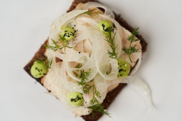 Smorrebrod with fried chicken, fennel and tarragon. Toasted bred with chicken
