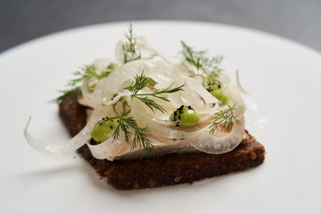 Smorrebrod with fried chicken, fennel and tarragon. Toasted bred with chicken