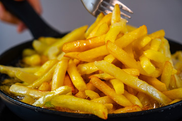 French fries and a fork