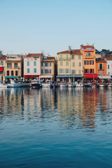 Fototapeta premium Colorful buildings and boats in the port of Cassis, France.