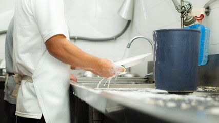 Fototapeta na wymiar Man washing dish