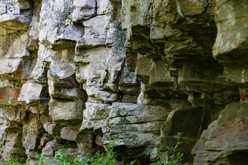 Zaitsev rocks in the Rostov region in Krasnosulinsky district, stone natural structures of large size, green and damp mosses among the vegetation, unusual species for walking.