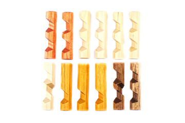Wooden pieces from a hexagon spike puzzle isolated on a white background.
