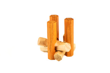 Wooden pieces from a hexagon spike puzzle isolated on a white background.