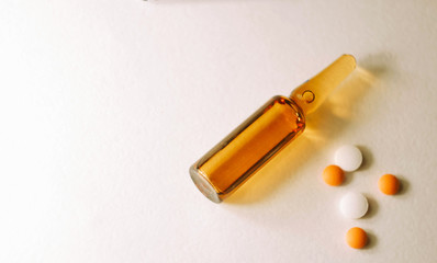 Ampoule with serum, pills and blisters. Pharmaceutical business wallpaper. Medical care. Vitamins drugs. Sickness treatment 