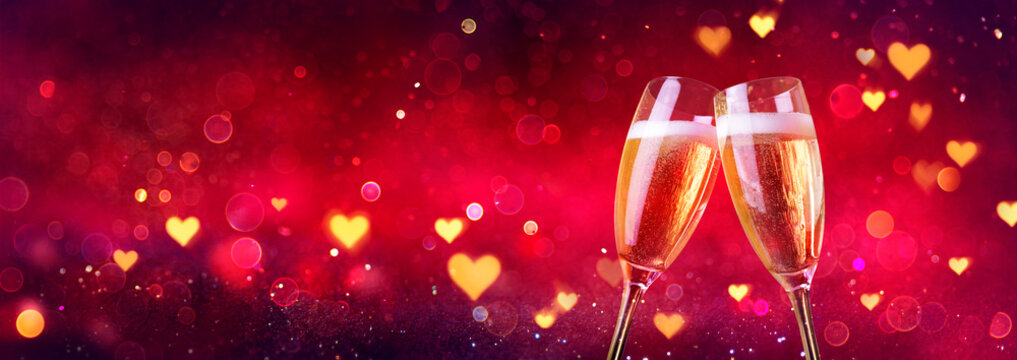 Valentines Celebration - Toast With Champagne With Defocused Lights In Red Shiny Background