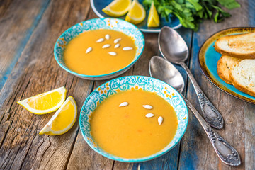 Lentil soup on a rustic wooden table