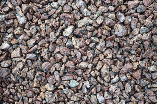Macro photo of crushed stone and gravel on the ground. Texture background stones. Image of broken stones