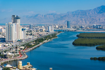 Aerial view of Ras al Khaimah, United Arab Emirates north of Dubai, looking at the city, , Jebal Jais - and along the Corniche.