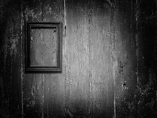 Old wooden frame on vintage blue wooden background