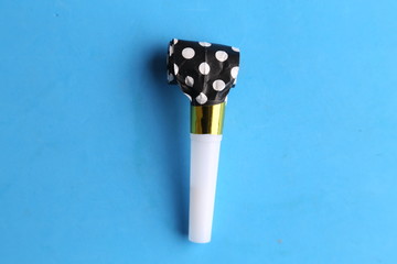 party whistle on colorful background