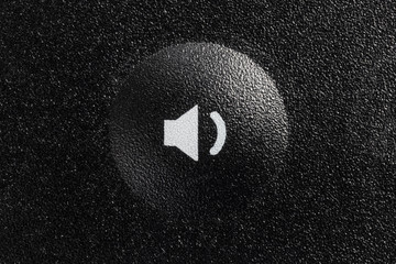 Low volume button on remote controller closeup macro photograph.  