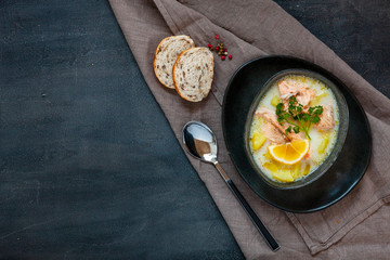 Traditional Finnish salmon soup  Lohikeitto with potato, creme and lemon
