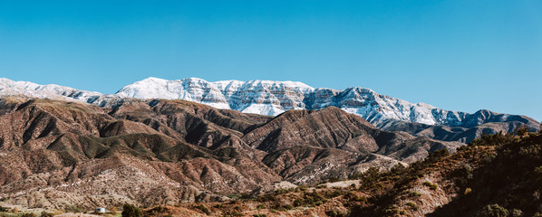 Snow covered Topa bluffs over Ojai Valley farms and vineyards