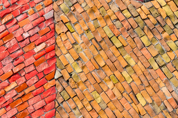 red and orange surface of abstract decorative smalt mosaic with high resolution for background. multicolored ceramic stones on wall building with your place for text
